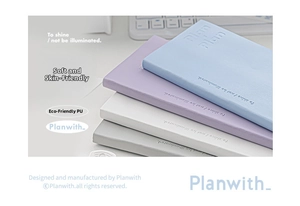Detail of four colorful PU leather planners with embossed minimalist typography and texture