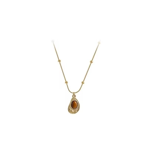 Collana vintage in acciaio al titanio dorato con ciondolo a goccia in occhio di tigre