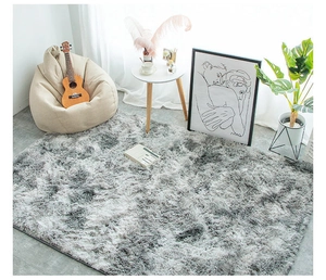 Plush grey and white round shag rug set in a cozy living room with a beige bean bag chair