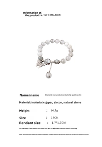 Détails du bracelet en perles œil de chat grises avec un pendentif papillon et zircons