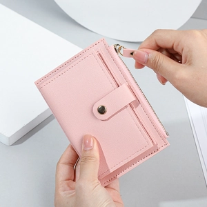 Pink minimalist short zipper wallet with multiple card slots and snap button closure