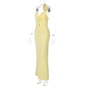 Detailed view of yellow halter neck dress with sexy knot cutout and metal ring detail