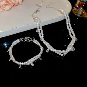 Double-layer pearl jewelry set with water-drop zircon necklace and matching bracelet