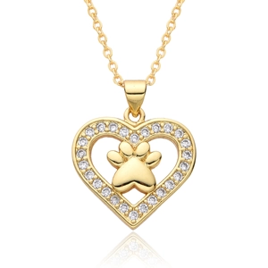 Detailed close-up of golden heart pendant with cat paw cutout and pavé cubic zirconia