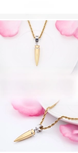 Detail of 18K gold-plated stainless steel bullet pendant on a twisted rope chain necklace