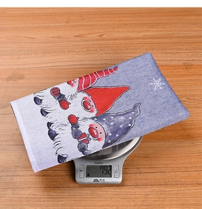 Detailed view of Christmas gnome chair cover on scale showing weight 79.2g