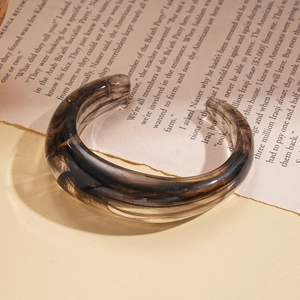 Retro acrylic C-shaped open bangle with brown marble texture in 45-degree view
