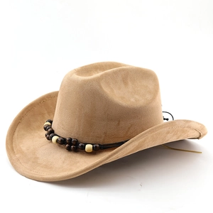 Detail of camel suede cowboy hat featuring tribal beaded band and wide brim design