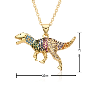 Detail view of a dinosaur pendant with color zircons showing dimensions 29mm by 17mm