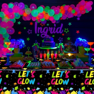 Neon Let's Glow party supplies set with blacklight reactive balloons and tablecloth