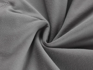 Close-up of soft dark gray knit fabric texture with high elasticity and fine ribs