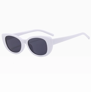 Detailed side view of white frame sunglasses showing smooth temple and lens structure
