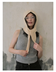 Close-up of cream white knitted hooded scarf showing soft texture and vintage weave