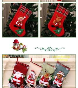 Detailed view of large burlap Christmas stockings with 3D Santa and Reindeer designs
