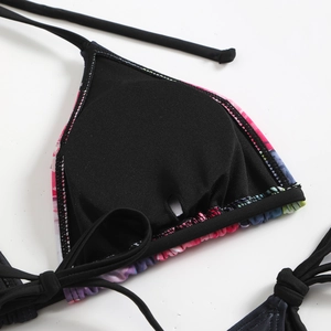 Detail of floral bikini top showing inner black lining and removable breast pad slots