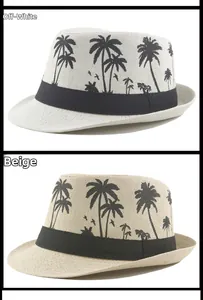 Detail of cream and beige straw fedora hats with black palm tree prints and bands