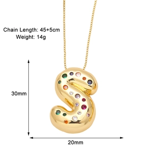 Detail of gold letter S pendant with colorful zircons and precise size measurements