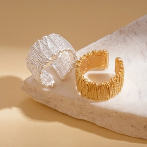 Modern geometric open rings with woven metal texture in gold and silver finishes