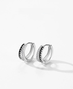 Detail of S925 sterling silver hoop earrings with micro-pave black and white zircon stones