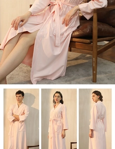 Detailed view of pink waffle weave robe texture with tie belt and deep side pockets