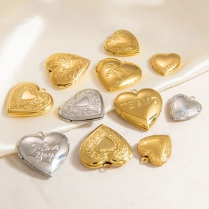 Polished heart locket pendants in gold and silver with engraved romantic patterns