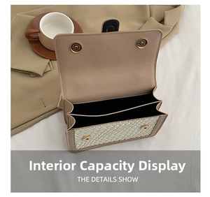 Top view of two interior compartments and magnetic closure of the woven texture bag
