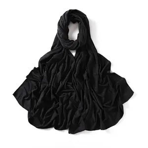 Detail of the soft black modal jersey scarf with natural draping and fine fabric texture
