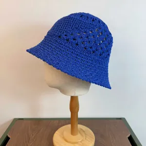 Detailed knit texture and hollow-out mesh design on royal blue woven bucket hat