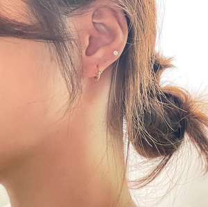 Minimalist S925 sterling silver knot hoop earrings with small clear crystal studs on ear