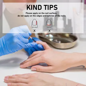 Instructional macro view of nail cuticle oil application area on natural nails