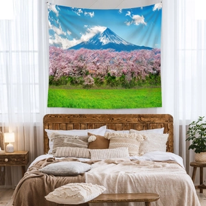 Detail of Mount Fuji tapestry showing pink cherry blossoms and polyester fabric texture