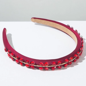 Detail of luxury baroque headband with red floral gemstones and sparkling rhinestones