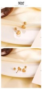Macro detail of 18K gold plated heart stud earrings with secure screw back closure