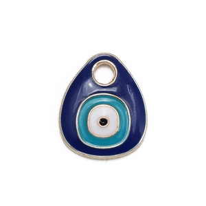 Detailed view of evil eye jewelry pendant with blue enamel and gold-plated edges