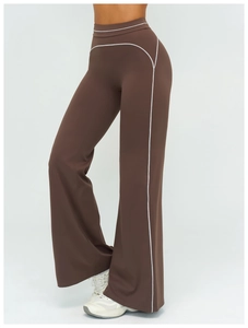 Detail showing brown wide-leg yoga pants with white contrast piping and high waist seam