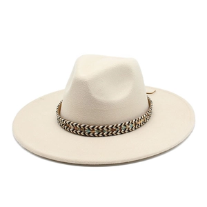 Detail of cream fedora hat featuring a bohemian woven band with ethnic V-shaped patterns