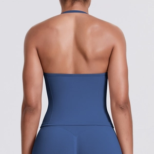 Detail of navy blue seamless yoga top featuring a halter back and high elasticity fabric