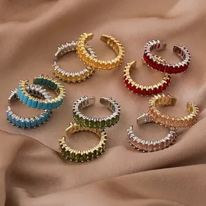 Minimalist open rings with multicolor square zircons on silk background