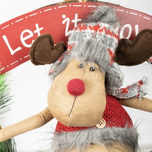Plush Christmas reindeer decoration with Let it Snow sign on white background
