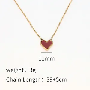 Macro view of red heart pendant with gold beaded edges and 39+5cm adjustable chain