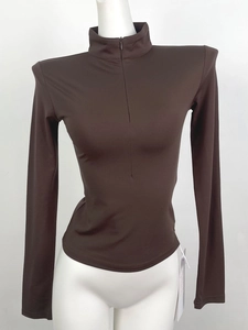 Slim fit dark brown long sleeve yoga top featuring a V-neck half-zip and stand collar design