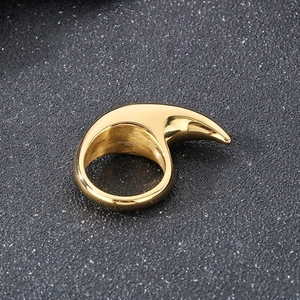 Detailed macro view of the gold-plated crescent moon shaped stainless steel ring