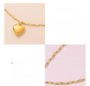 Detail of 18K gold plated heart pendant bracelet with a unique twisted chain design