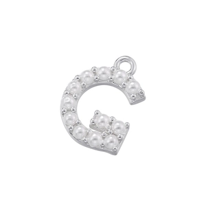Detail of letter G pendant with pearl inlays and silver-plated finish for jewelry