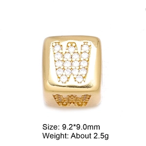 Macro shot of 9mm gold-plated letter W bead with cubic zirconia for DIY jewelry