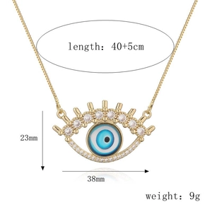 Detail view of gold Evil Eye pendant with clear dimensions and length measurements