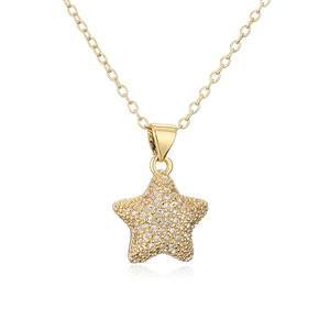 Macro view of 18K gold plated star pendant necklace with shimmering zircon stones