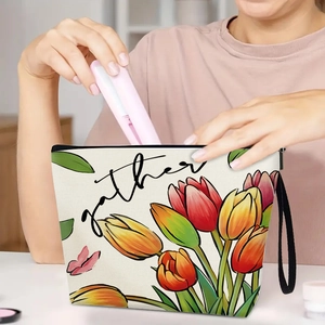 Waterproof tulip print makeup bag with zipper and handle showing cosmetic storage usage