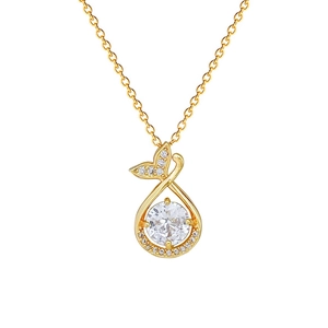 Elegant gold fish tail necklace with sparkling crystal drop pendant on white background