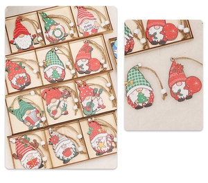 Close-up of assorted wooden Christmas gnomes with colorful hats in a divided box